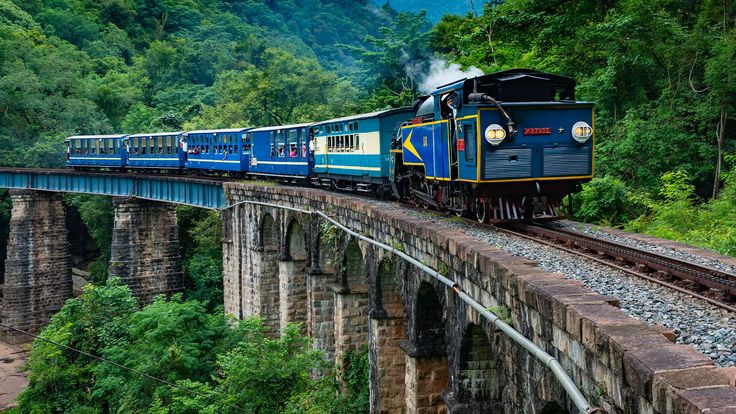 Nilgiri Mountain Railway winding through green hills